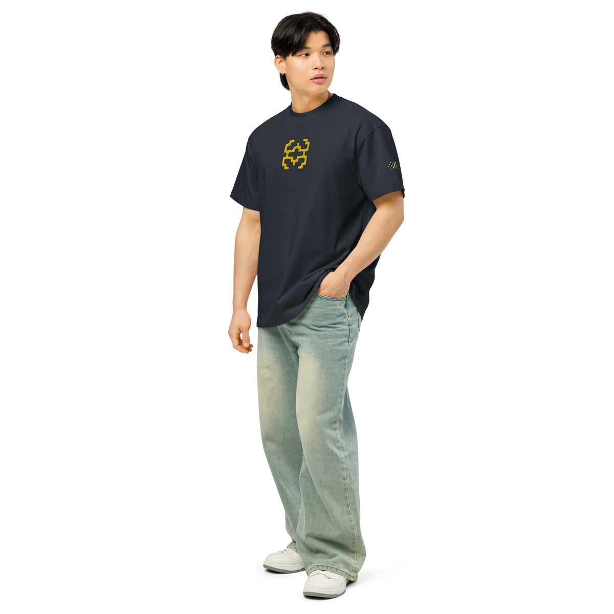Invaders embroidered box tee in Navy Blazer, left front on a person, full length: yellow figure on chest, dot mark on sleeve