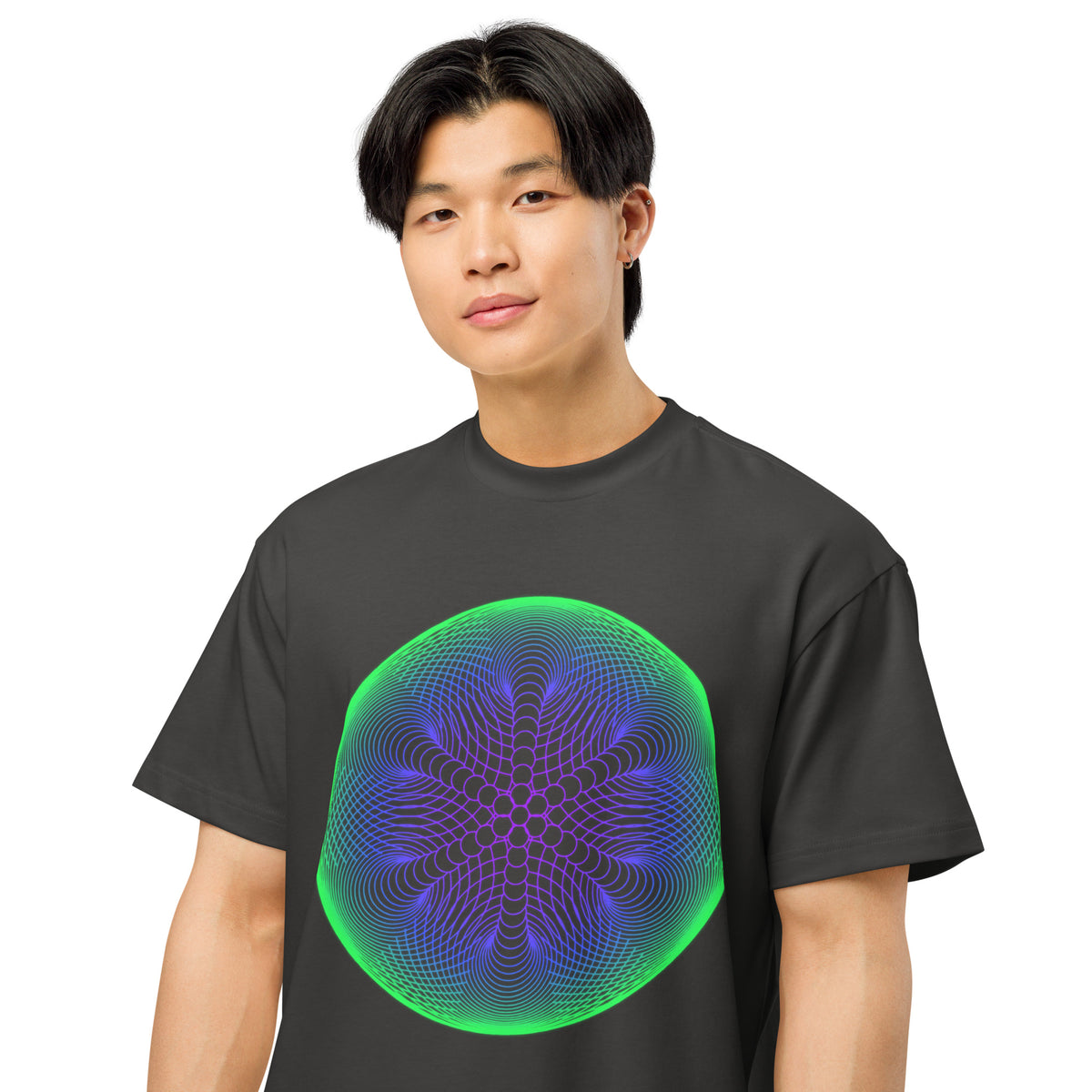 Star Weave cotton box t-shirt in Vintage Black, close front view on a model: six arms of stacked circles inside a green rim