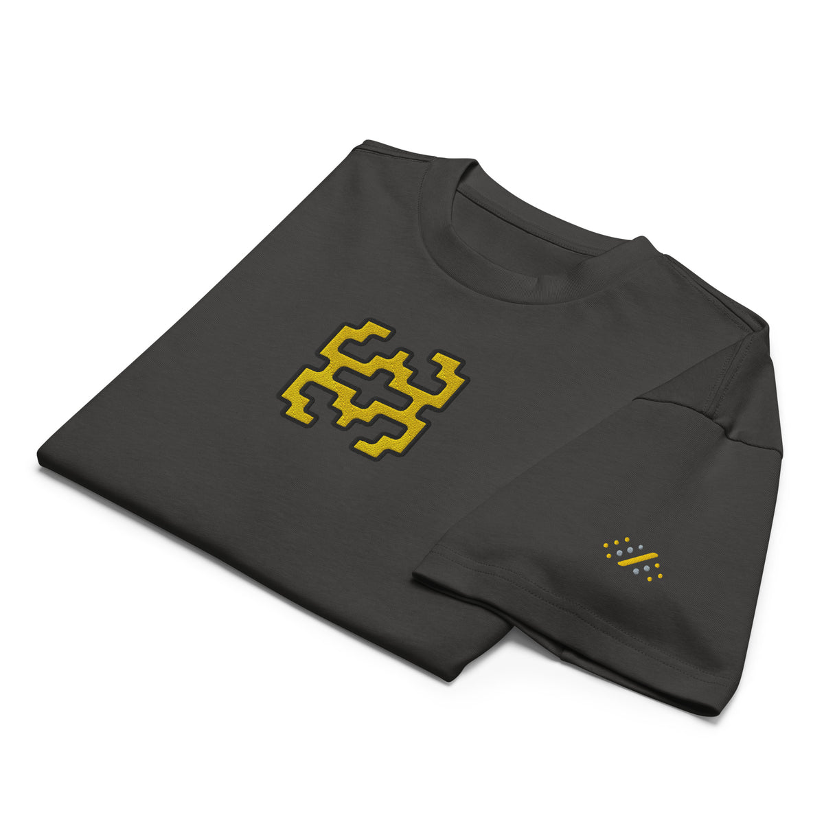 Invaders embroidered box tee in Vintage Black, folded, detail: golden yellow figure, yellow and grey dot mark on the sleeve
