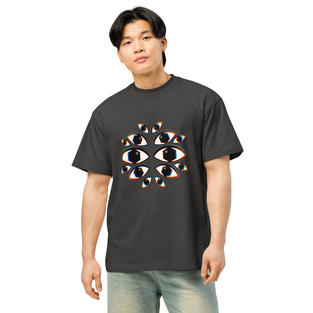 I See You cotton box t-shirt in Vintage Black, front on a person: fourteen white eyes with black hexagon pupils on the chest