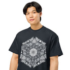 GeoMaster B&W cotton box t-shirt in Navy Blazer, on a person, close: white and grey geometric hexagon across the chest