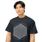 Life of a Flower B&W cotton box t-shirt in Navy Blazer, close front view on a model: white six-petal flowers and arcs