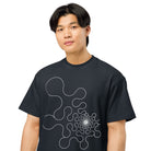 Metaball B&W cotton box t-shirt in Navy Blazer, close front view on a model: rounded lobes tightening into a dense core