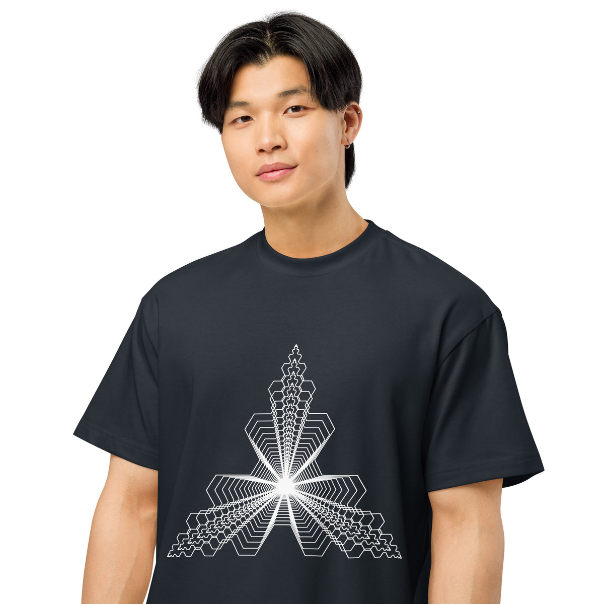 Fractal Triangle B&W cotton box t-shirt in Navy Blazer, on a model, close: white hexagon lines meeting in a bright centre