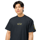 Owl embroidered box tee in Navy Blazer, close on a person: yellow half-ring eyes, slanted brows, diamond beak, sleeve mark