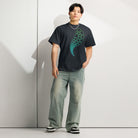Hexa cotton box t-shirt in Navy Blazer, full-length front view on a model: green to turquoise tail of cells and hexagons