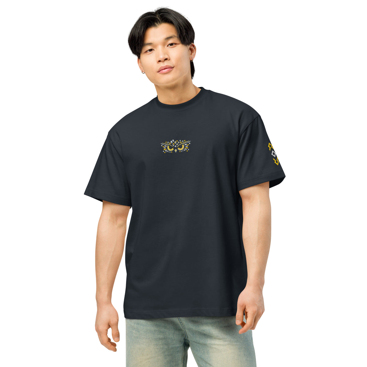 Owl embroidered box tee in Navy Blazer, front on a person: owl face on the chest, yellow and white mark on the left sleeve