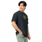 Invaders embroidered box tee in Navy Blazer, right front on a person: golden yellow stepped figure on the chest