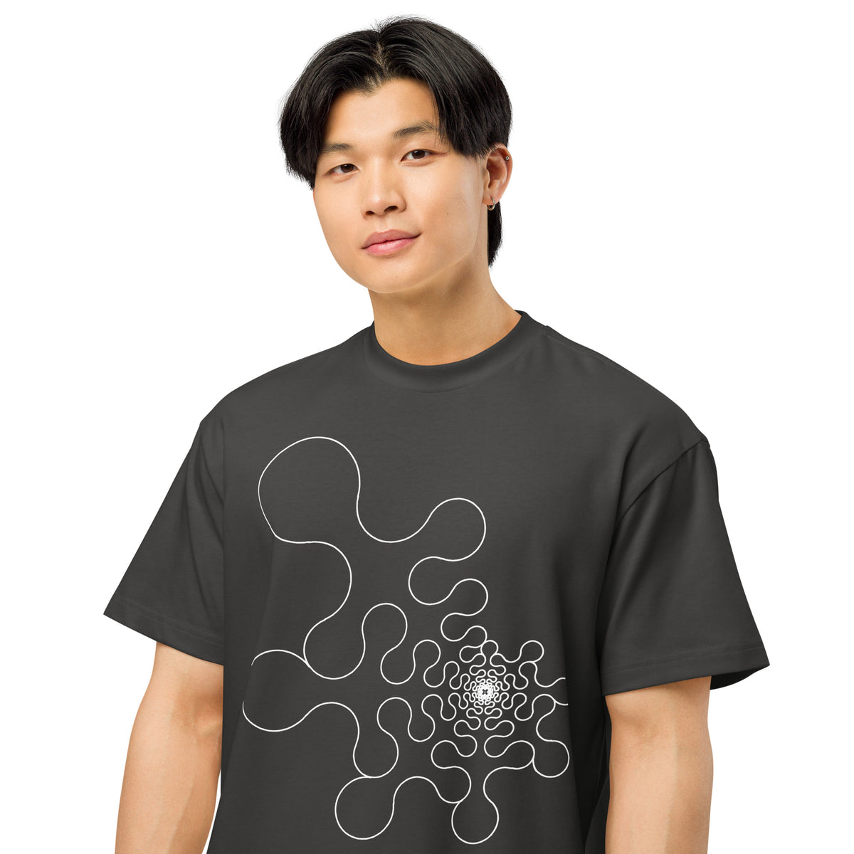 Metaball B&W cotton box t-shirt in Vintage Black, close front view on a model: rounded lobes tightening into a dense core
