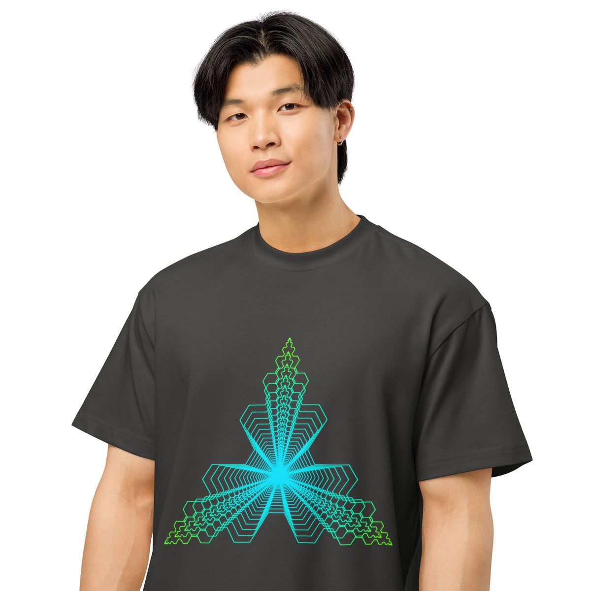 Fractal Triangle cotton box t-shirt in Vintage Black, on a model, close: hexagon lines meeting in a turquoise centre