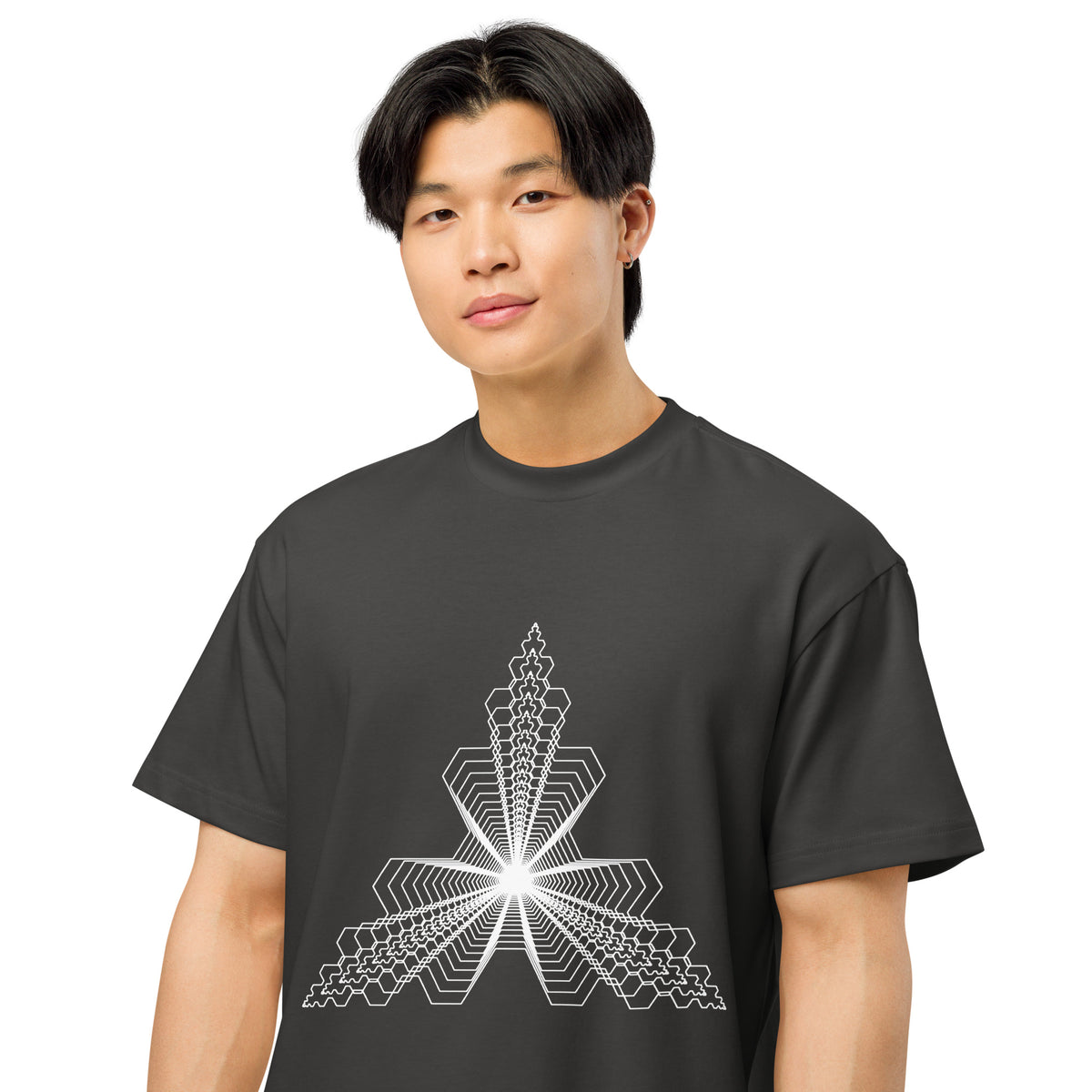 Fractal Triangle B&W cotton box t-shirt in Vintage Black, on a model, close: white hexagon lines meeting in a bright centre