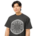 Star Weave B&W cotton box t-shirt in Vintage Black, close front view on a model: six arms of stacked white circles