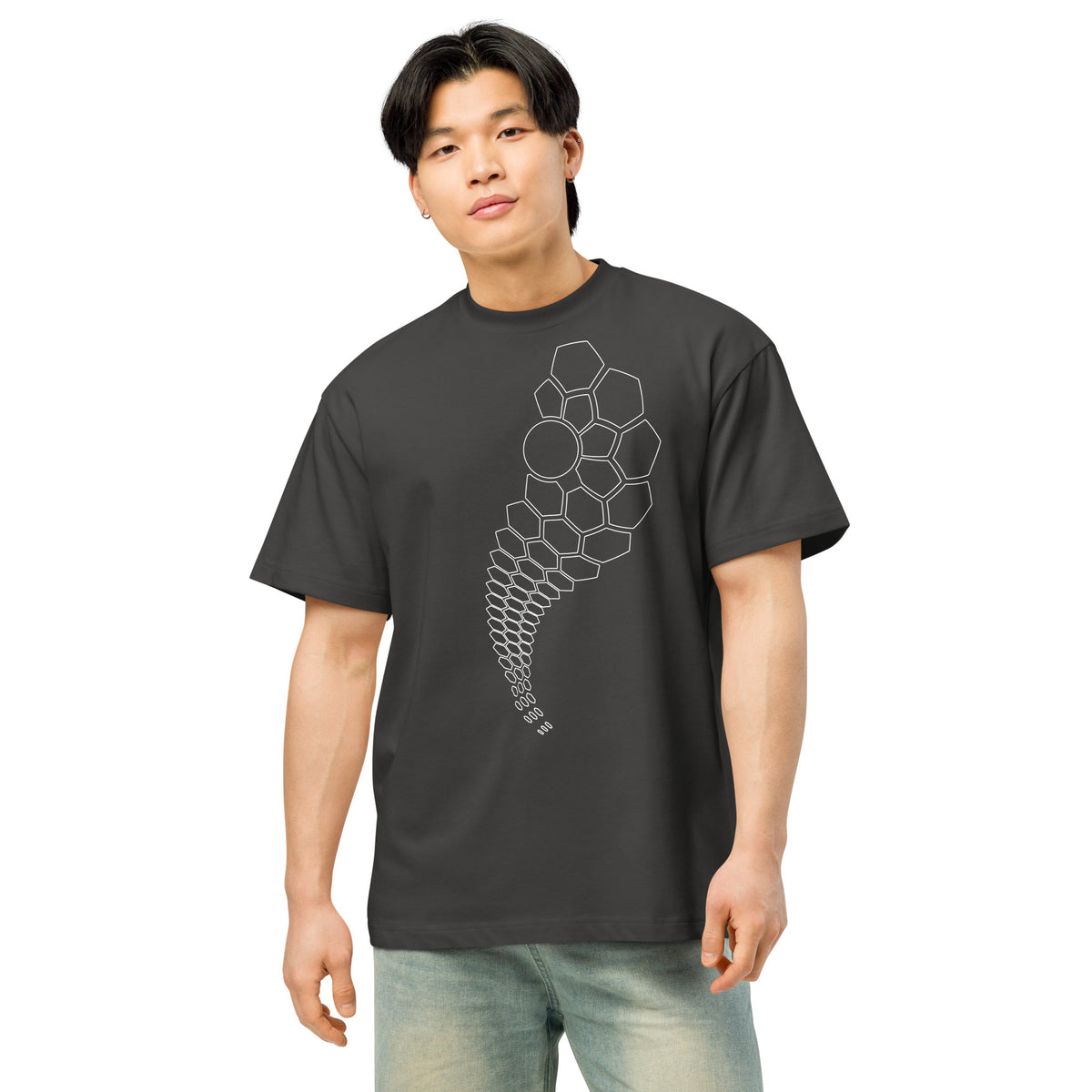 Hexa B&W cotton box t-shirt in Vintage Black, front view on a model: white hexagon outlines tapering to mid-shirt