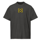 Invaders embroidered box tee in Vintage Black, front view: golden yellow stepped figure with a black outline, centre chest