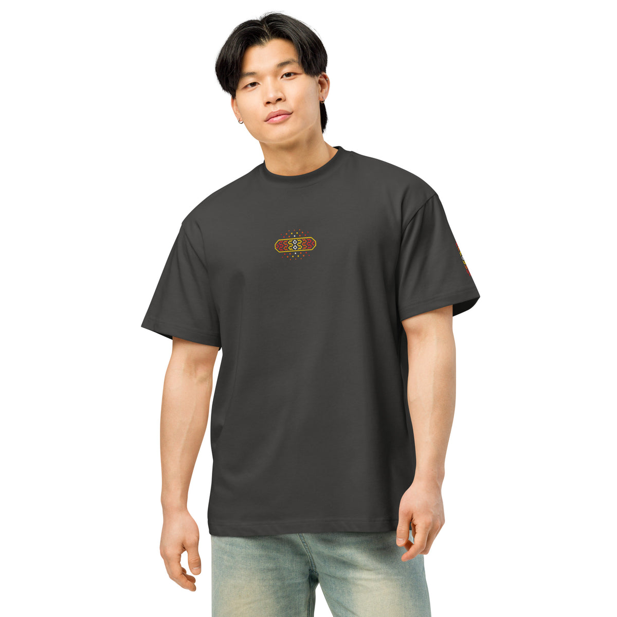 Invaders 2 embroidered box tee in Vintage Black, front on a person: small multicolour badge on chest, strip on left sleeve