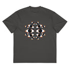 I See You cotton box t-shirt in Vintage Black, flat front: fourteen mirrored eyes with black hexagon pupils on the chest