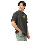 Invaders embroidered box tee in Vintage Black, right front on a person: golden yellow stepped figure on the chest