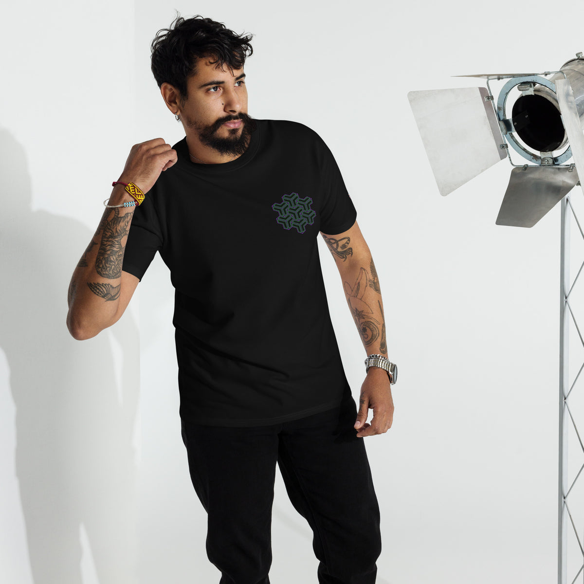 Neural Star Tree premium heavyweight t-shirt in Black, front view on a model: TreeStar small on the left chest
